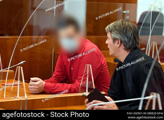 01 September 2020, North Rhine-Westphalia, Bonn: The accused waits beside his lawyer Sebastian Holbeck (r) for the judgement