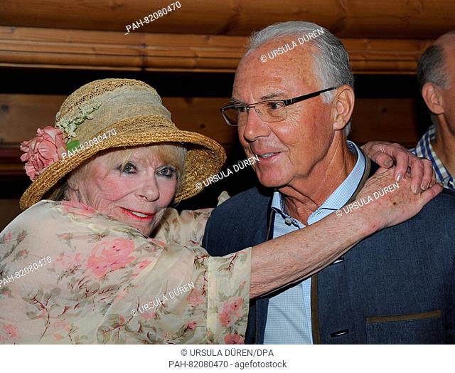 Football legend Franz Beckenbauer and actress Elke Sommer pose at the get-together of the Bavarian evening in the context of the 29th Kaiser Cup golf tournament...