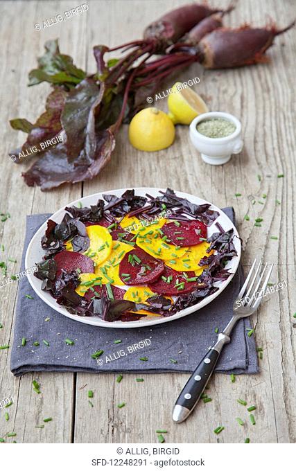 Beetroot carpaccio with beetroot leaves and chives