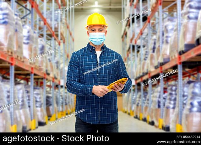 male worker wearing face mask at warehouse