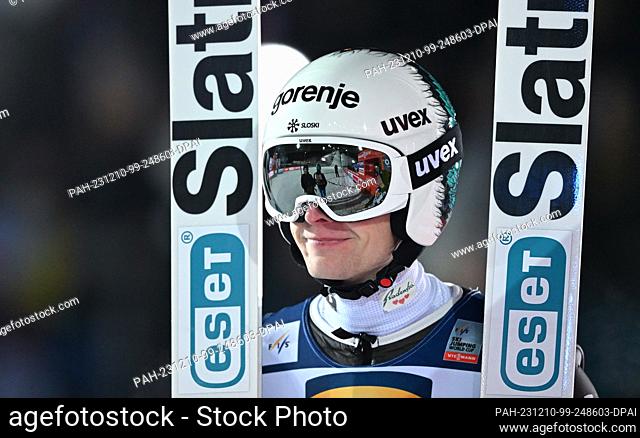 10 December 2023, Saxony, Klingenthal: Nordic skiing/ski jumping, World Cup, large hill, men, 2nd round. Lovro Kos from Slovenia reacts after his jump