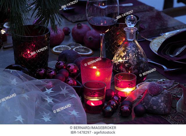 Detail of a festively set table with candles in a stylish ambience