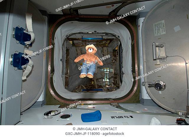Smokey Bear floats freely near a hatchway on the International Space Station. On May 15, 2012, Smokey traveled aboard the Soyuz spacecraft with NASA astronaut...