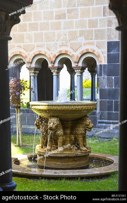 Lion fountain in the closed garden of paradise, surrounded by the cloister, monastery church, Maria Laach monastery, Eifel, Rhineland-Palatinate, Germany