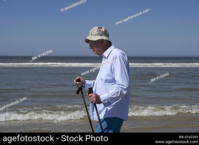 Older man walking on the beach, Juist Island, North Sea, East Frisia, Lower Saxony, Germany, Europe