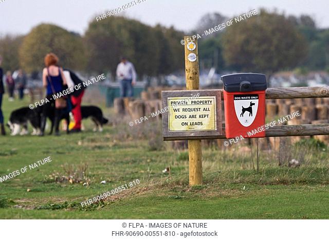 'Private Property', We Request All Dogs Are Kept On Leads' and 'Public Footpath' sign beside dog waste bin, Dunster Beach, near Minehead, Somerset, England