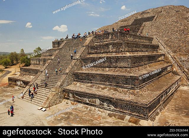 Tourists climbing up and down the Pyramid of the Moon- Piramide de la Luna in Teotihuacan Archaeological Site, Teotihuacan, Mexico City, Mexico, Central America