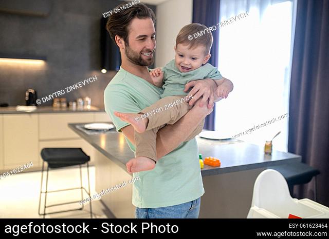 Young family. Dad and son looking happy spending time together