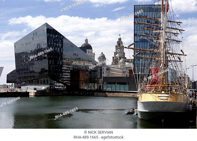 Part of Port of Liverpool Building and Royal Liver Building seen across Canning Dock with sailing ship Kaskelot, Liverpool, Merseyside, England, United Kingodm