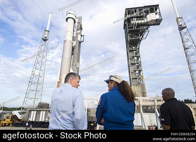 Steve Stich, manager of NASA’s Commercial Crew Program, left, and NASA astronaut Suni Williams, center, are seen as the United Launch Alliance Atlas V rocket...