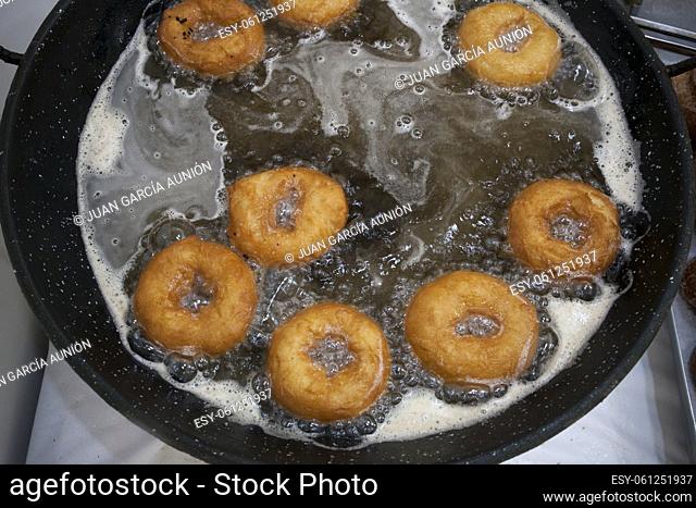 Elaboration process of spanish typical fried donuts or roscas fritas. Overhead view