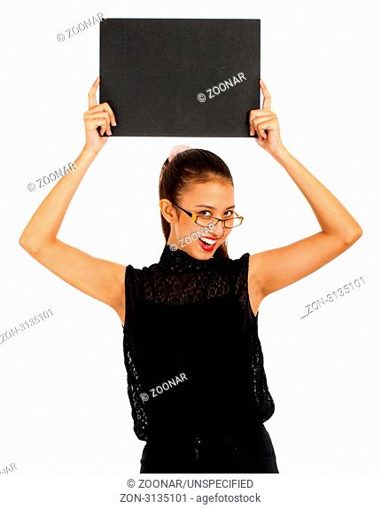 Blank Black Board Being Held Up By A Young Smiling Girl