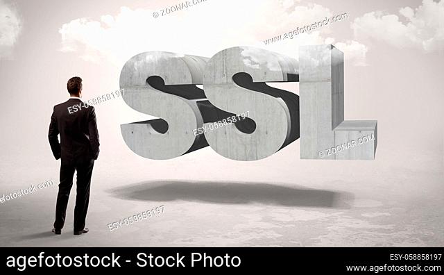 Rear view of a businessman standing in front of SSL abbreviation, modern technology concept