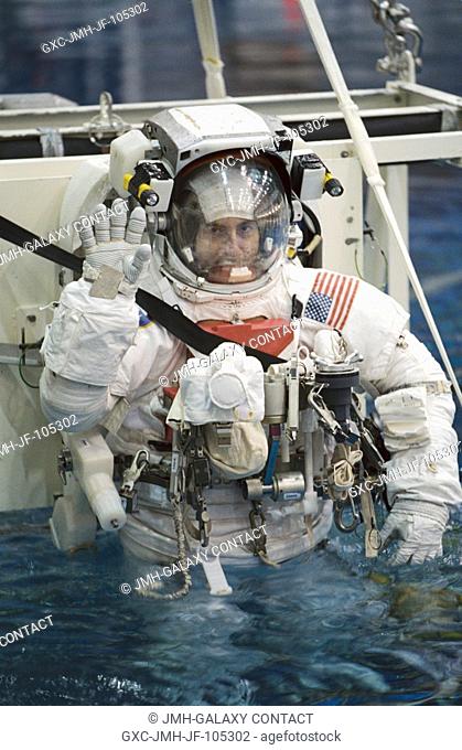Astronaut Philippe Perrin, STS-111 mission specialist, attired in a training version of the Extravehicular Mobility Unit (EMU) space suit