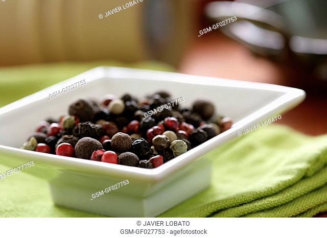 Five berries mix on a square plate