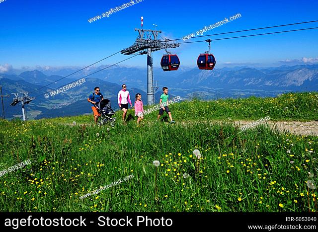 Family hiking on the summit panorama trail of the Hohe Salve, Hopfgarten, Brixental, Kitzbühel Alps, Tyrol, Austria, Europe