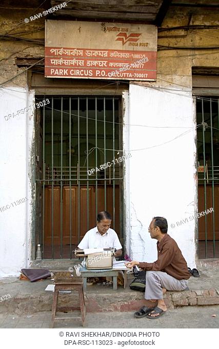 Park circus post office men typing letters for illiterate ; postal services of Calcutta now Kolkata ; West Bengal ; India