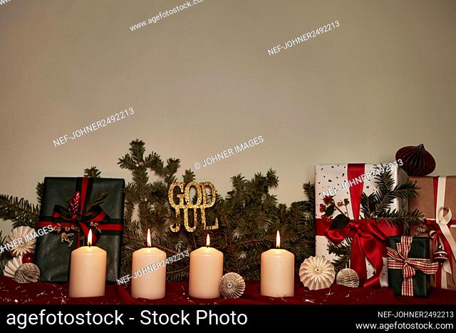 Christmas decorations with Advent candles and Christmas presents