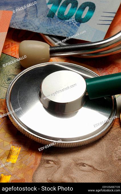 Stethoscope on South African banknotes and coins