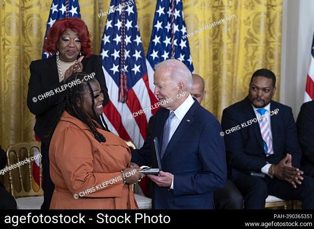 United States President Joe Biden presents the Presidential Citizens Medal to Election Worker Shaye Moss during a ceremony marking the the two-year anniversary...