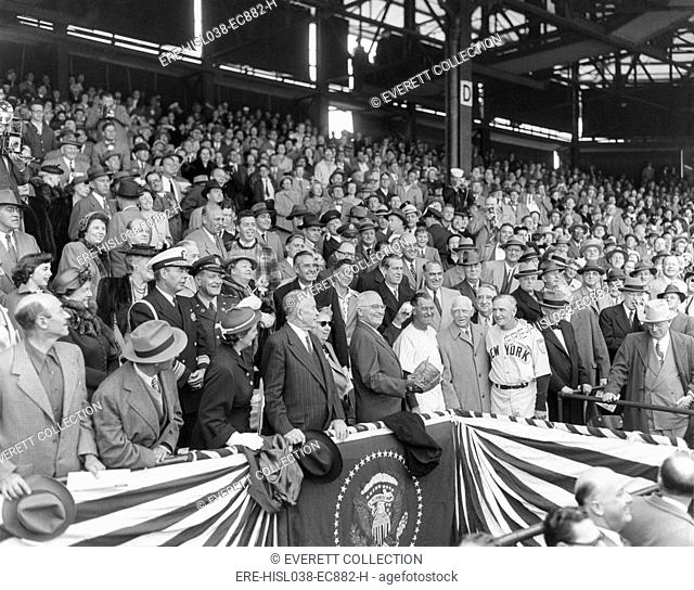 President Harry Truman about to throw the first ball at the 1951 of the season at Griffith Stadium. April 20, 1950. With the President are: Mrs