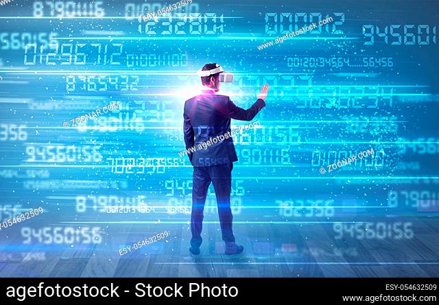 Businessman in vr glasses with variable fast changing numbers around