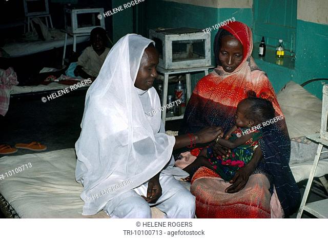 Geneina Sudan Nurse With Chadean Refugee Mother & Child