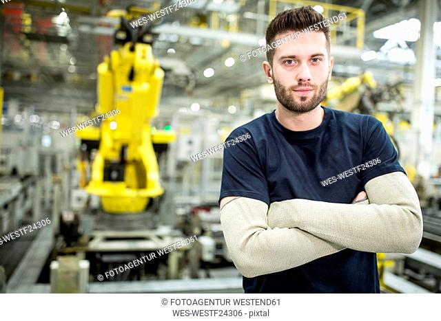 Portrait of confident worker in a modern factory