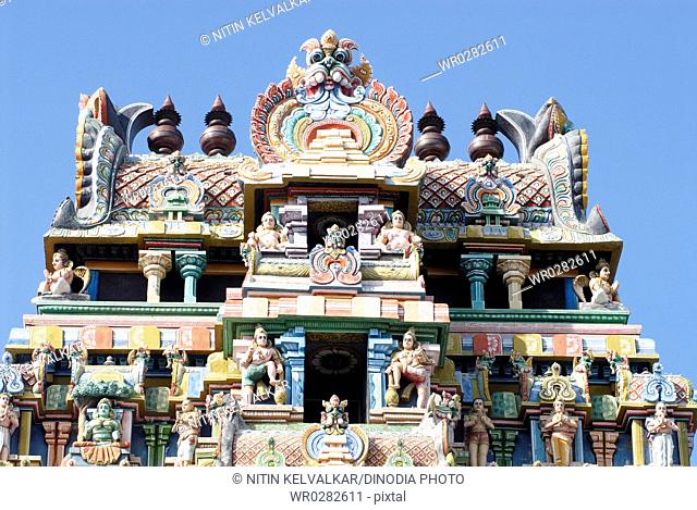 Gopuram richly decorated stucco figures on impressive gateway of Sri Ranganathswami temple , Tiruchirapalli Trichy , Tamil Nadu , India
