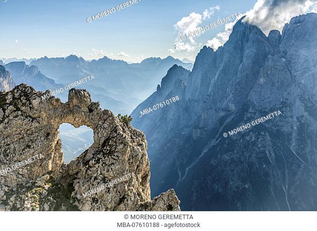 Europe, Italy, Veneto, Belluno, Agordino. The heart of rock, a natural hole in the shape of a heart, Pala group, Dolomites
