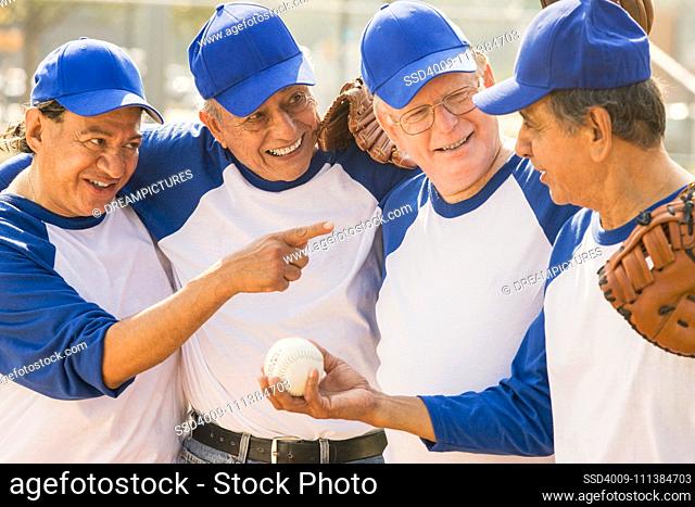 Senior men playing on baseball team
