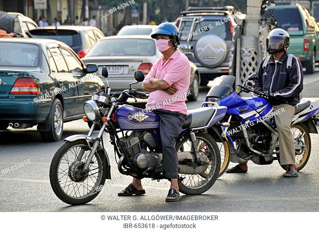 Motorcyclist wearing surgical mask in Koh Chang, Thailand, Southeast Asia, Asia
