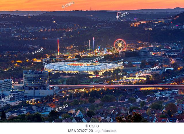 Germany, Stuttgart, night view from the Rotenberg to Daimler stadium and funfair