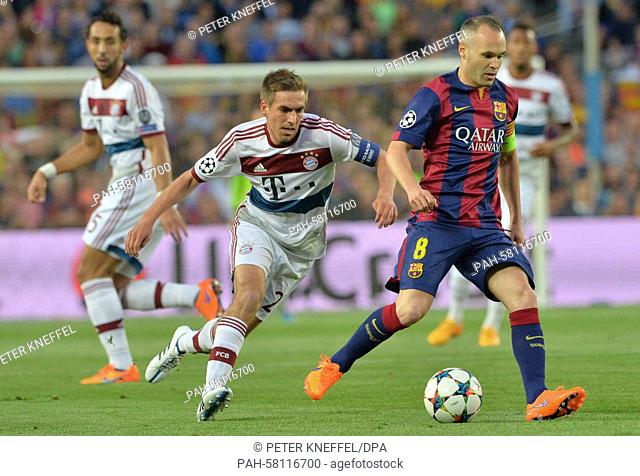 Barcelona's Andres Iniesta (R) and Munich's Philipp Lahm (C) vie for the ball during the UEFA Champions League semi-final first leg soccer match betweeen...