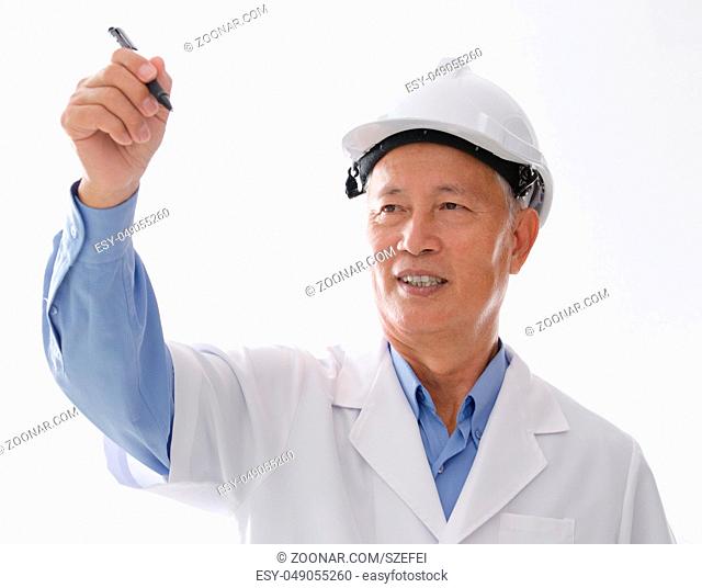 Portrait of Asian engineer with hard hat, hand writing on blank space, standing isolated on white background