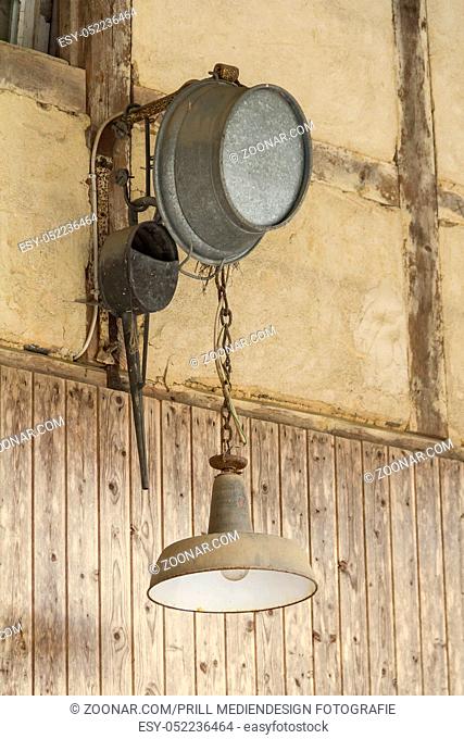 rural nostalgic lamp on a half-timbered barn facade in Southern Germany