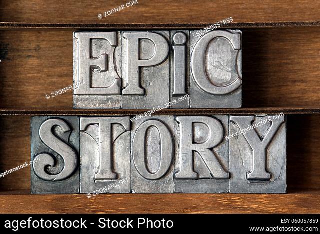 epic story phrase made from metallic letterpress type on wooden tray