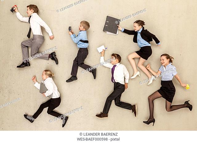 Business kids running in office