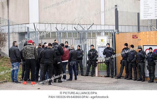26 March 2018, Germany, Stuttgart: Visitors standing at the entrance to the court before the start of the trial against alleged leader of the Turkish...