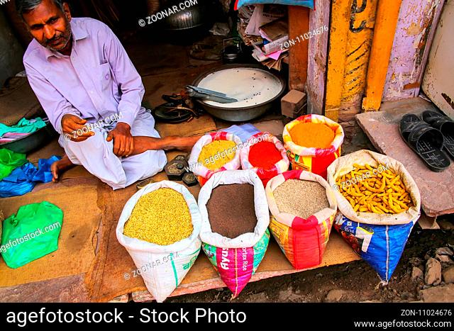 Local man selling spices at the street market in Fatehpur Sikri, Uttar Pradesh, India. The city was founded in 1569 by the Mughal Emperor Akbar
