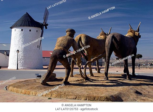 The sculpture of a farmer and ox by the windmill in Munera is associated with the author Miguel de Cervantes