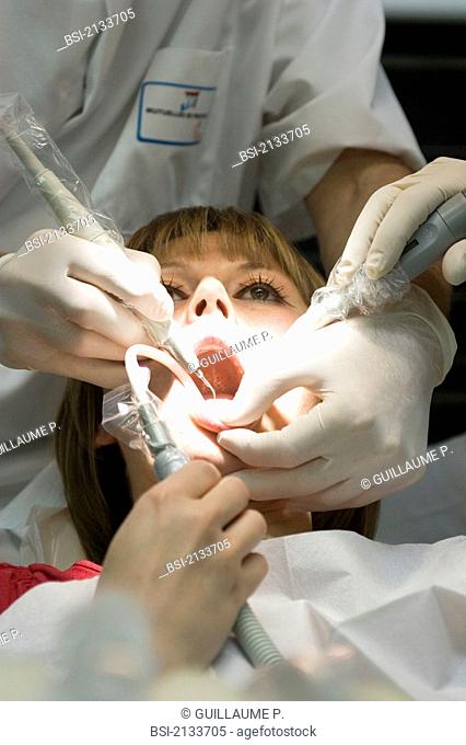 WOMAN RECEIVING DENTAL CARE<BR>Photo essay from dental office.<BR>Scaling