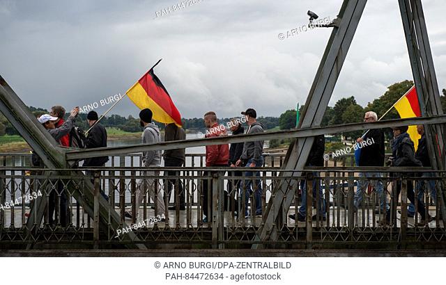 Rallying participants from the Pegida movement and the right-wing spectrum will cross the 'Blaues Wunder' brige in Dresden, Germany, 03 October 2016