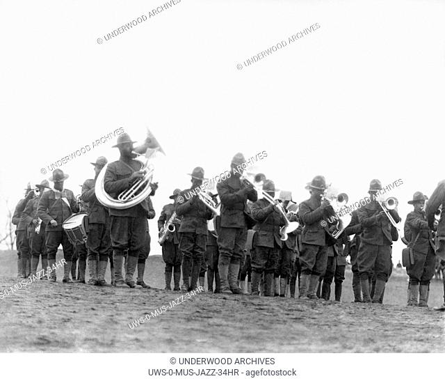 World: c. 1918. Members of the 369th Infantry Regiment band under the direction of Lt. James Reese Europe. The 369th was also known as the Harlem Hellfighters