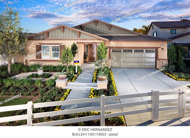 Exterior shot of a house with garage against the sky; Menifee; California; USA