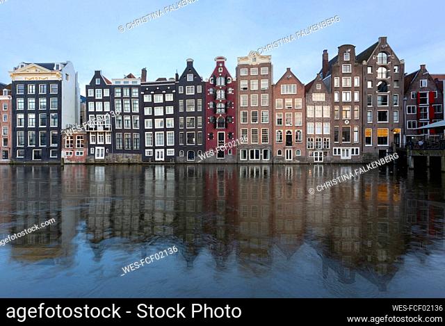 Netherlands, North Holland, Amsterdam, ¶ÿRow of townhouses along canal