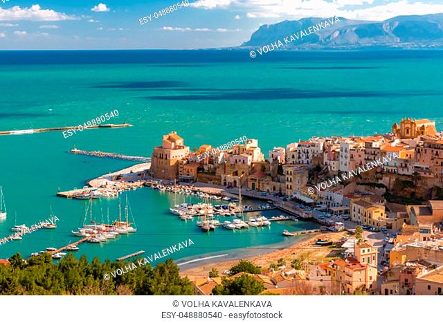 Beautiful aerial view of medieval fortress in Cala Marina, harbor in coastal city Castellammare del Golfo in the morning, Sicily, Italy