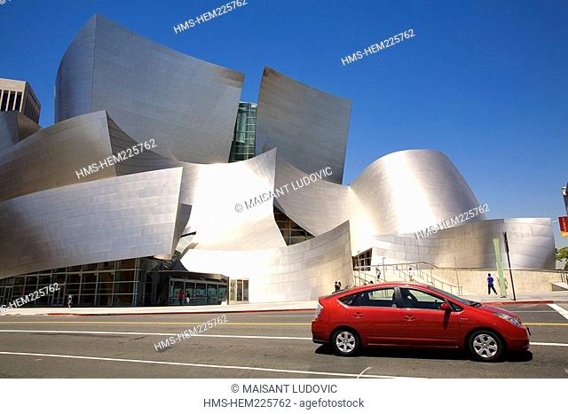 United States, California, Los Angeles, Downtown, Toyota Prius passing in front of the Walt Disney Concert Hall by architect Frank Gehry
