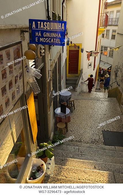 COIMBRA, PORTUGAL - August 13, 2016: Tourists explore the ancient lanes of the historic university city of Coimbra, Portugal