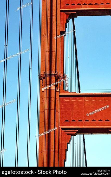 Orange pylon and steel cables of the suspension bridge, detail, Golden Gate Bridge, blue sky, San Francisco, California, USA, North America